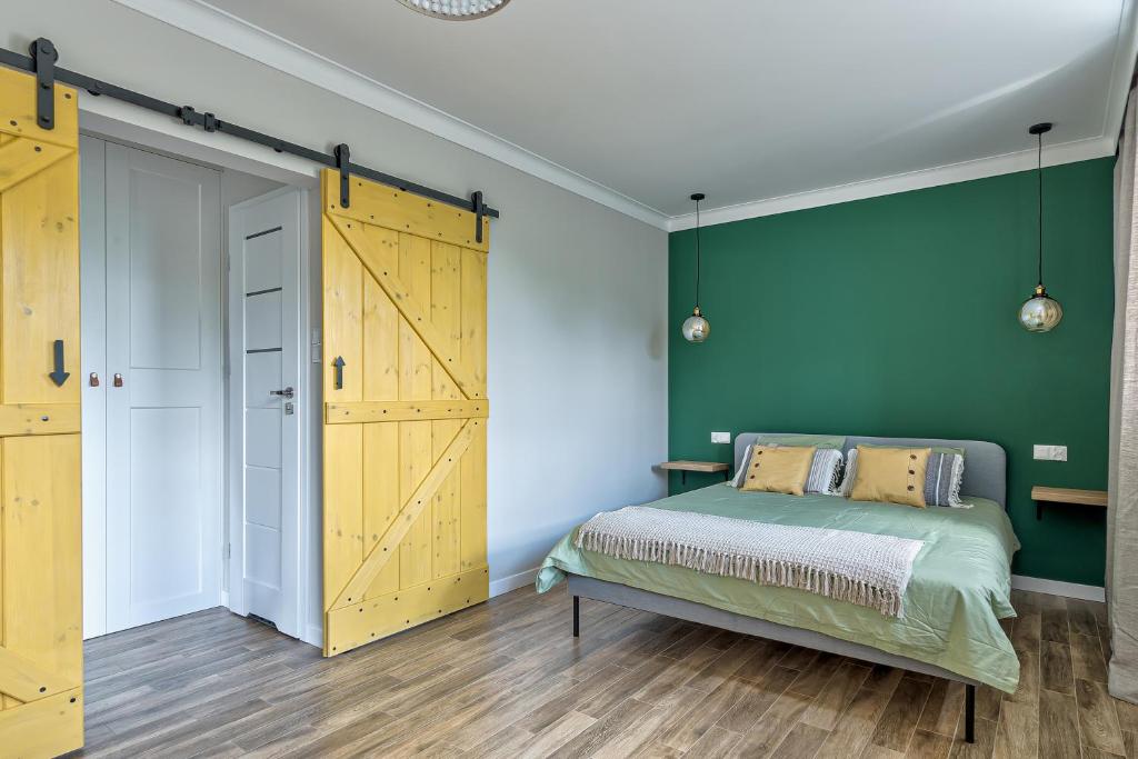 Posteľ alebo postele v izbe v ubytovaní Apartament Wschodni
