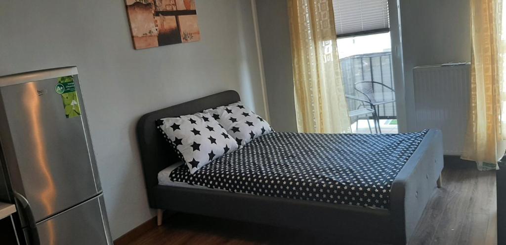 Vuode tai vuoteita majoituspaikassa Apartament Oskar