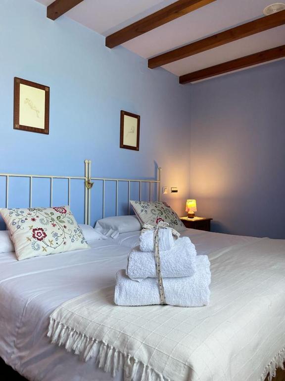Cama o camas de una habitación en Hotel Rural As Laguas