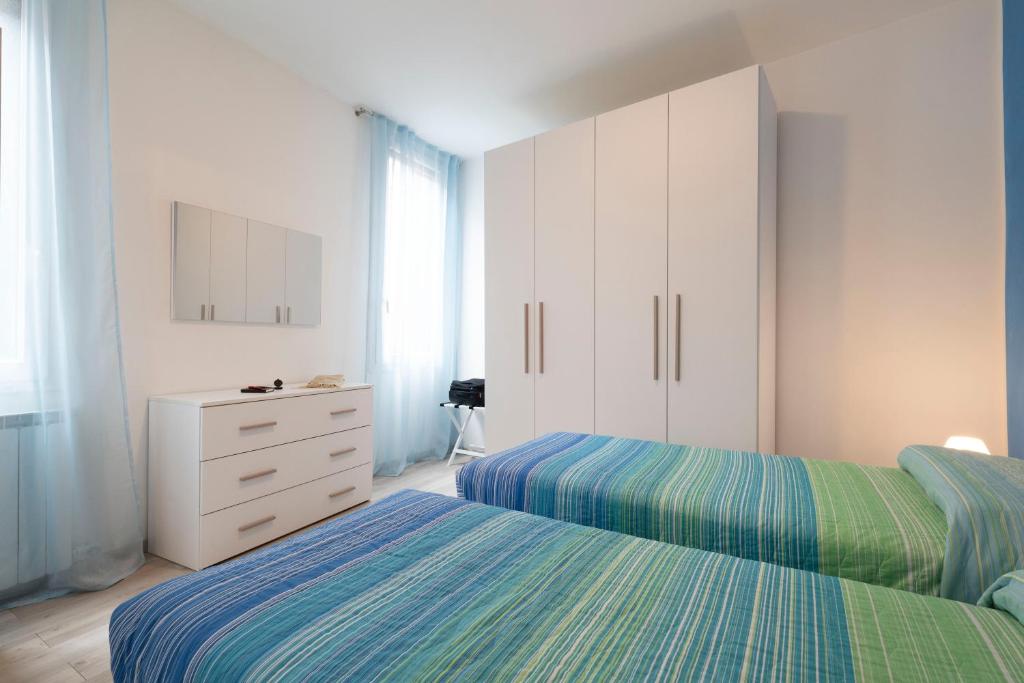 Łóżko lub łóżka w pokoju w obiekcie Ponte Squero Flat M0270423226