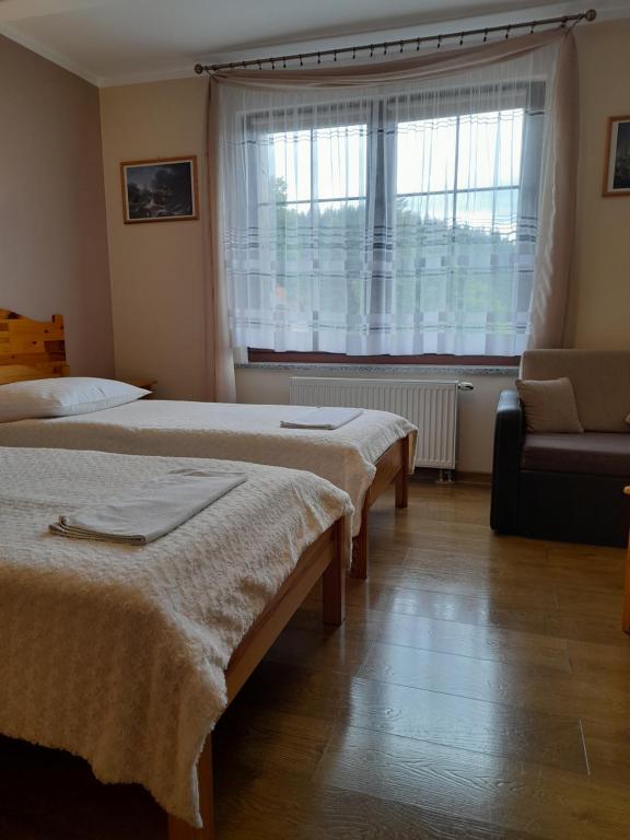 Posteľ alebo postele v izbe v ubytovaní EMAR