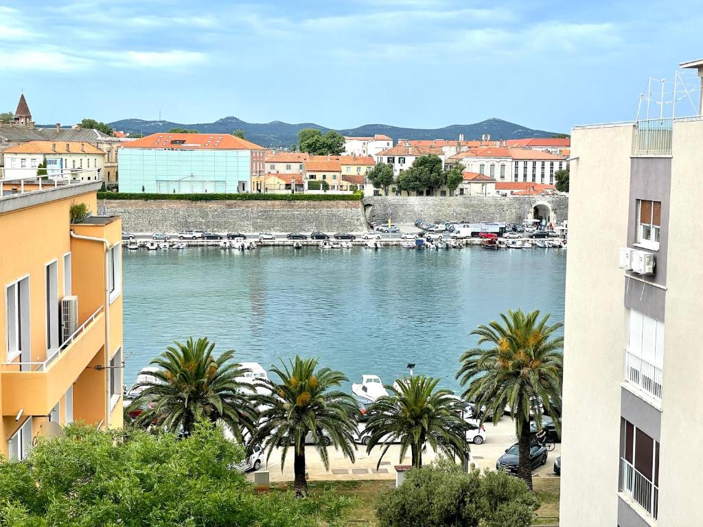 a view of a river with boats in a harbor at Sea view apartment in the city center with free parking in Zadar