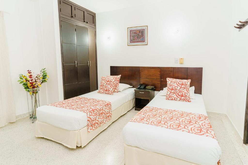 Postel nebo postele na pokoji v ubytování Hotel Las Molas