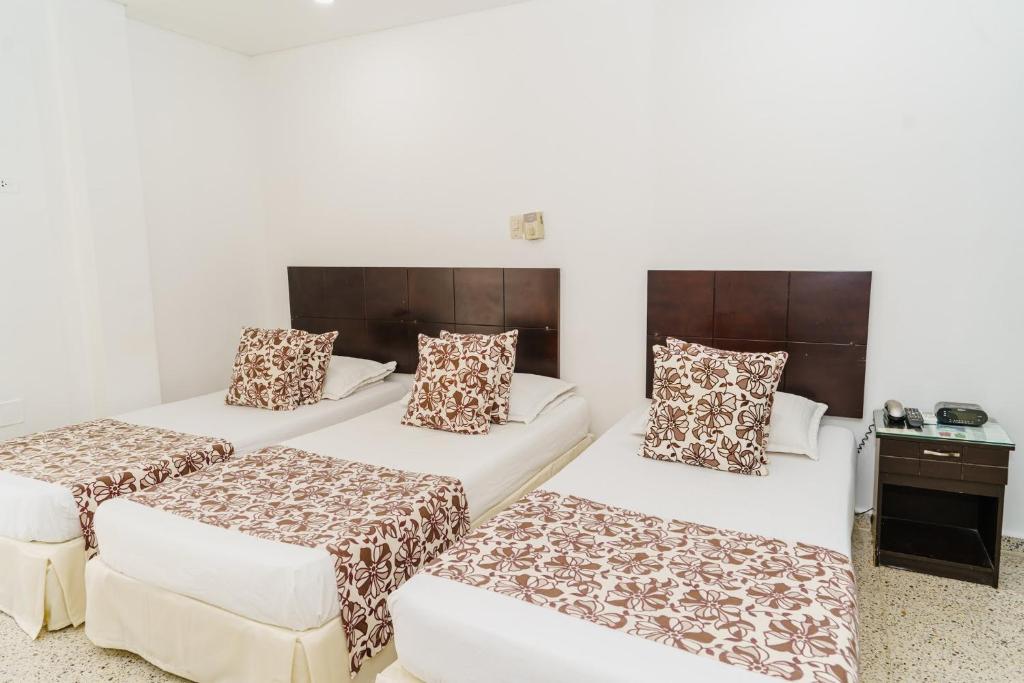 Postel nebo postele na pokoji v ubytování Hotel Las Molas