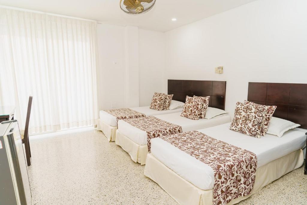Postel nebo postele na pokoji v ubytování Hotel Las Molas