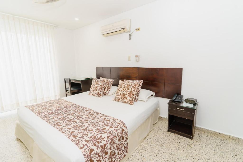 Postel nebo postele na pokoji v ubytování Hotel Las Molas