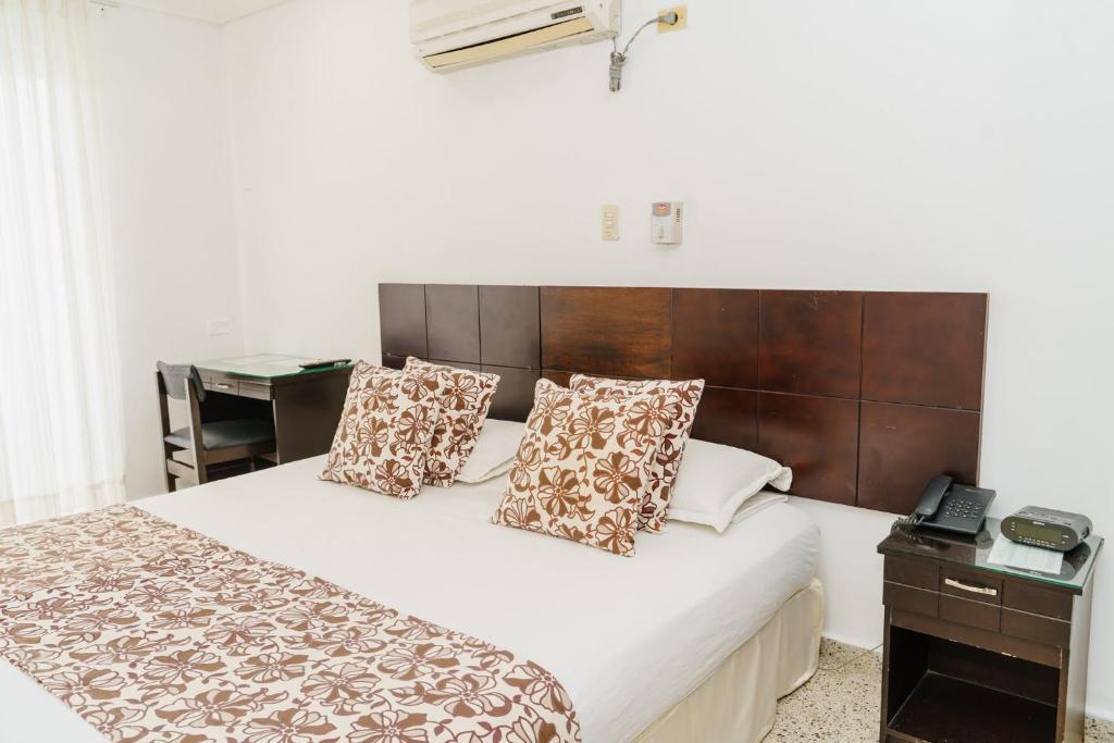 Postel nebo postele na pokoji v ubytování Hotel Las Molas