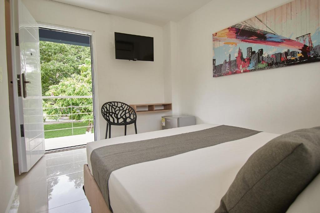 Postel nebo postele na pokoji v ubytování Arena de Santa Fe by Bernalo Hotels