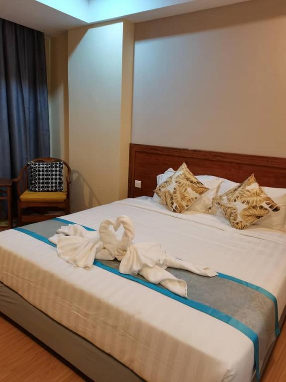 Postel nebo postele na pokoji v ubytování TD CAPITAL HOTEL