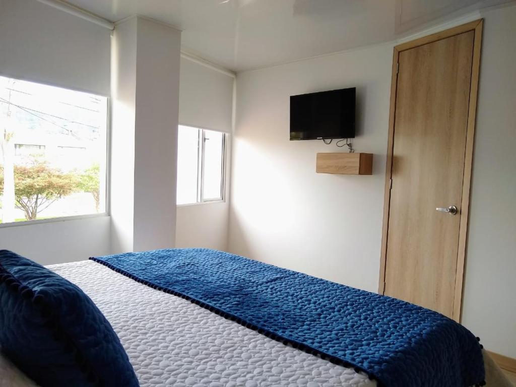 Postel nebo postele na pokoji v ubytování Hotel Federman Park Bogota