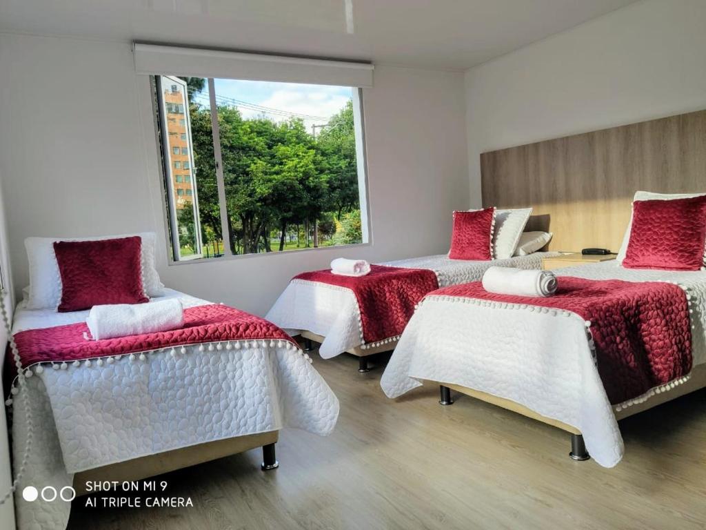 Postel nebo postele na pokoji v ubytování Hotel Federman Park Bogota