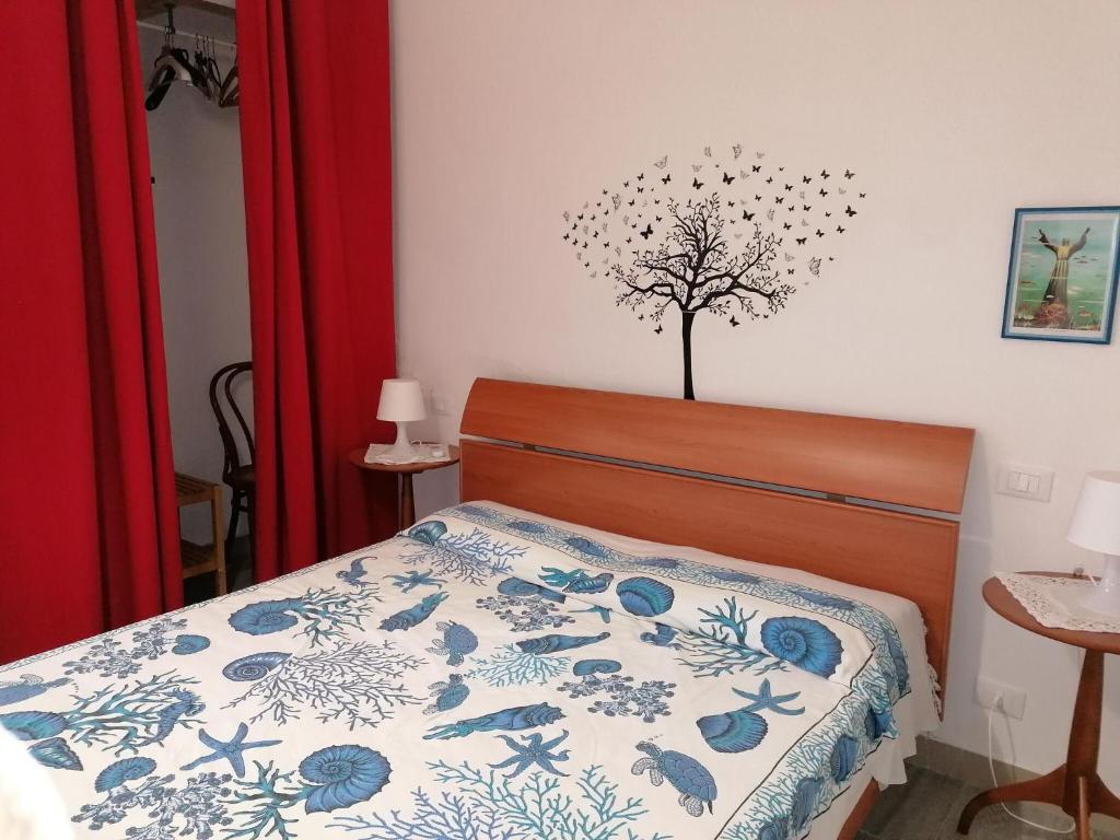 Posteľ alebo postele v izbe v ubytovaní Belvilla by OYO Blu Corallo Spiaggia