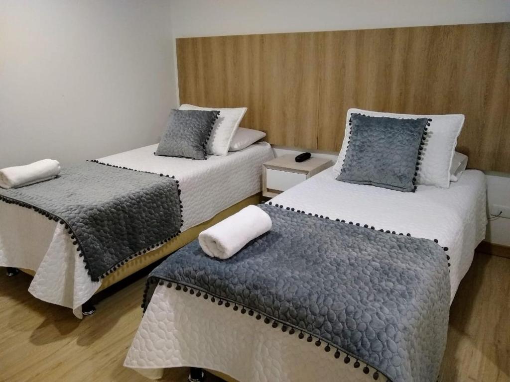 Postel nebo postele na pokoji v ubytování Hotel Federman Park Bogota