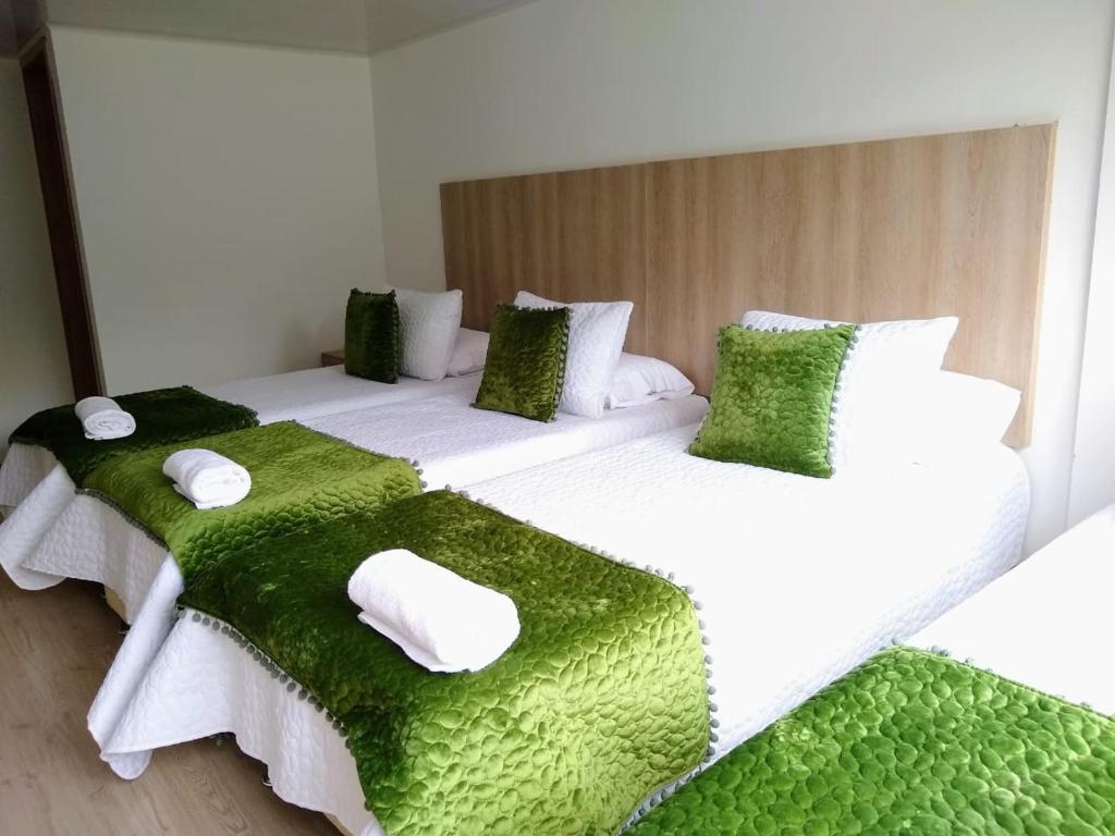 Postel nebo postele na pokoji v ubytování Hotel Federman Park Bogota