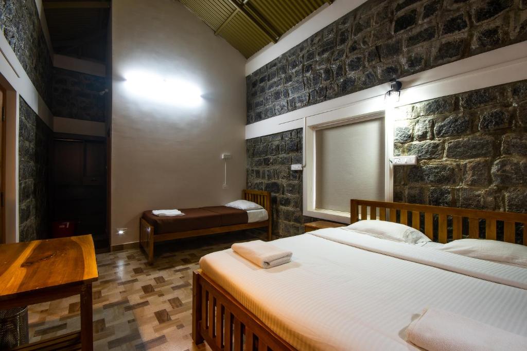 Postel nebo postele na pokoji v ubytování Tranqville Resorts