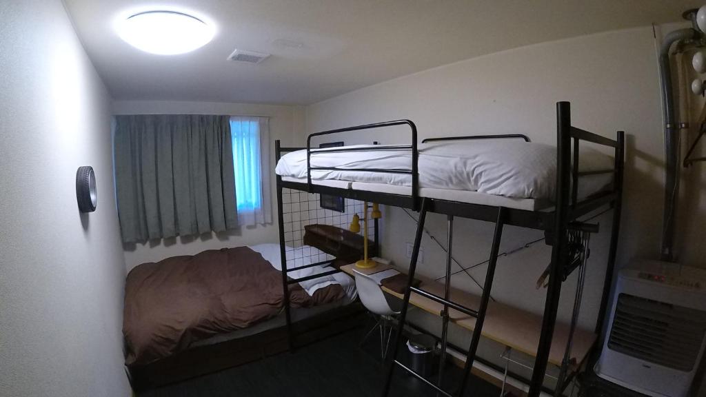 Postel nebo postele na pokoji v ubytování P-Dash Garden Backpackers