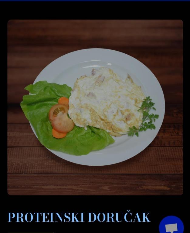 a plate of food with mashed potatoes and vegetables at Greenspace in Niš