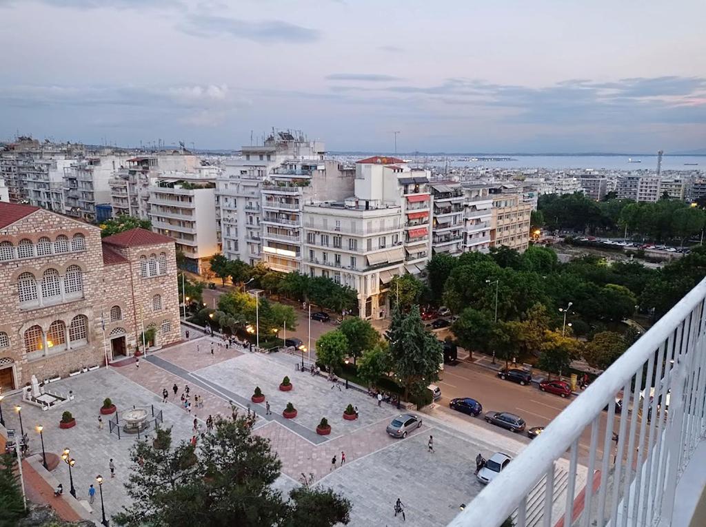 a view of a city from the balcony of a building at nona's in Thessaloniki