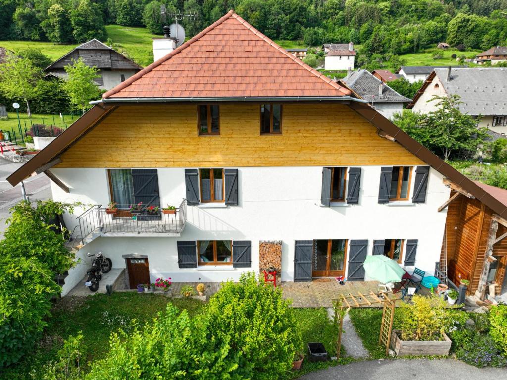 a large white house with a red roof at Big and lovely house in a quiet place in Giez