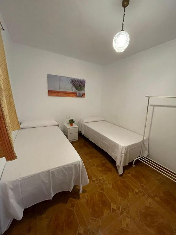 Postel nebo postele na pokoji v ubytování Casa Rural Los Caballos Finca Canca Alora Caminito del Rey