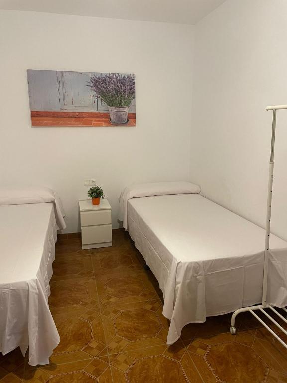 Postel nebo postele na pokoji v ubytování Casa Rural Los Caballos Finca Canca Alora Caminito del Rey