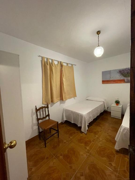 Postel nebo postele na pokoji v ubytování Casa Rural Los Caballos Finca Canca Alora Caminito del Rey