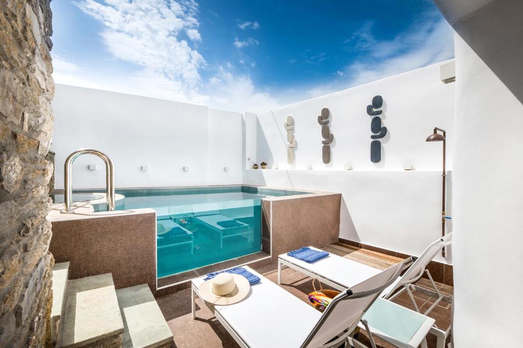 The swimming pool at or close to The Old Court Council Luxury mansion by Ifigeneia