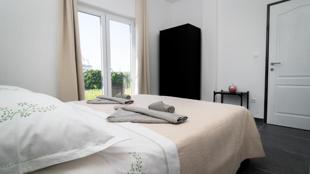 Postel nebo postele na pokoji v ubytování Apartman A2 s vlastitim bazenom