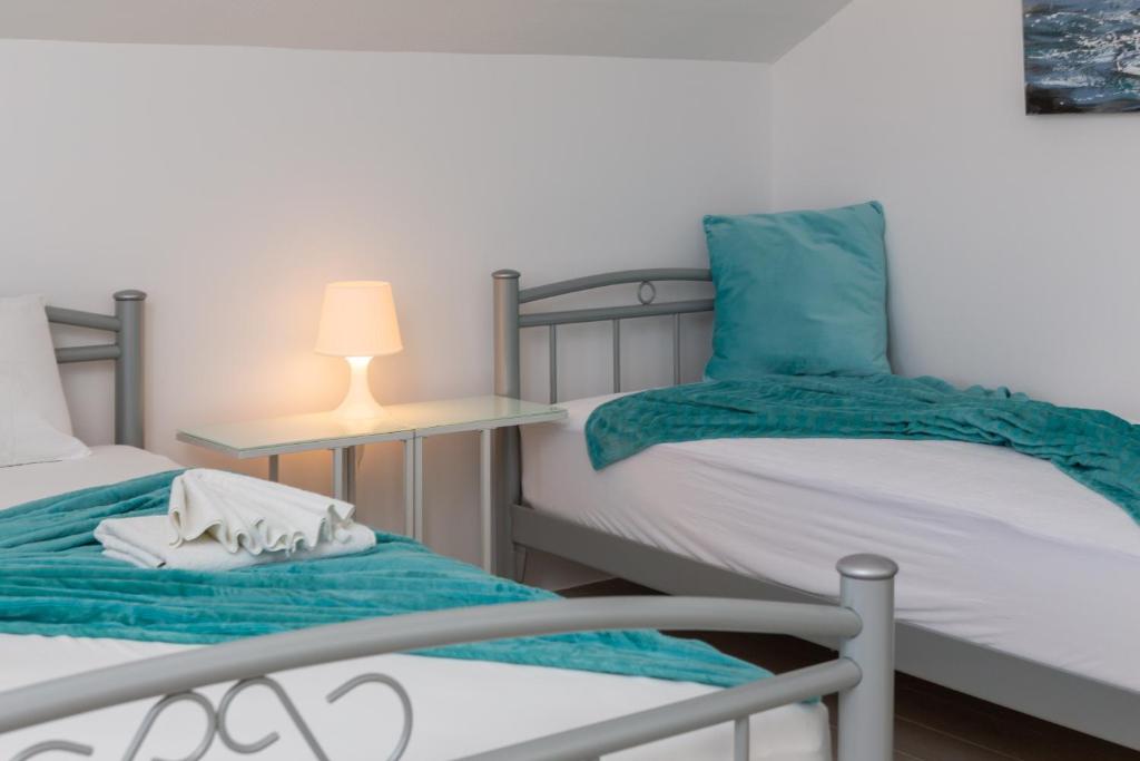 Posteľ alebo postele v izbe v ubytovaní Vila Blanka Apartments