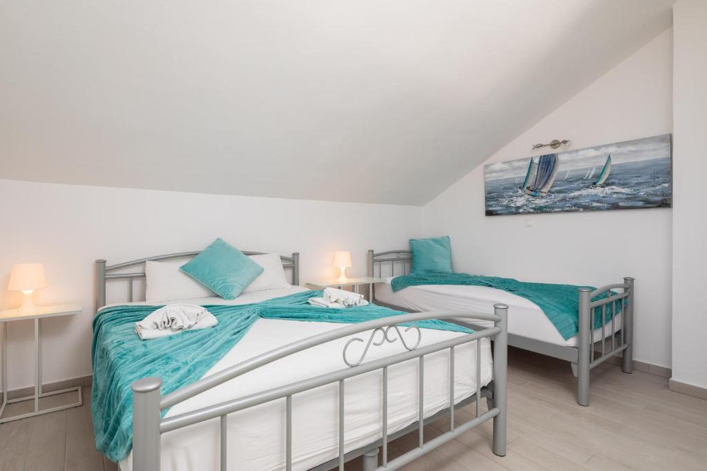 Posteľ alebo postele v izbe v ubytovaní Vila Blanka Apartments