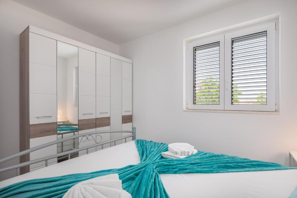 Posteľ alebo postele v izbe v ubytovaní Vila Blanka Apartments