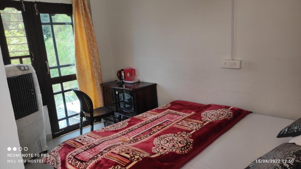 Postel nebo postele na pokoji v ubytování Hill Veu Home Bir Billing