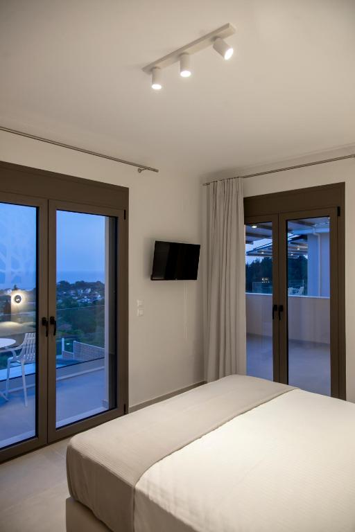 Posteľ alebo postele v izbe v ubytovaní LUMIERE VILLAS