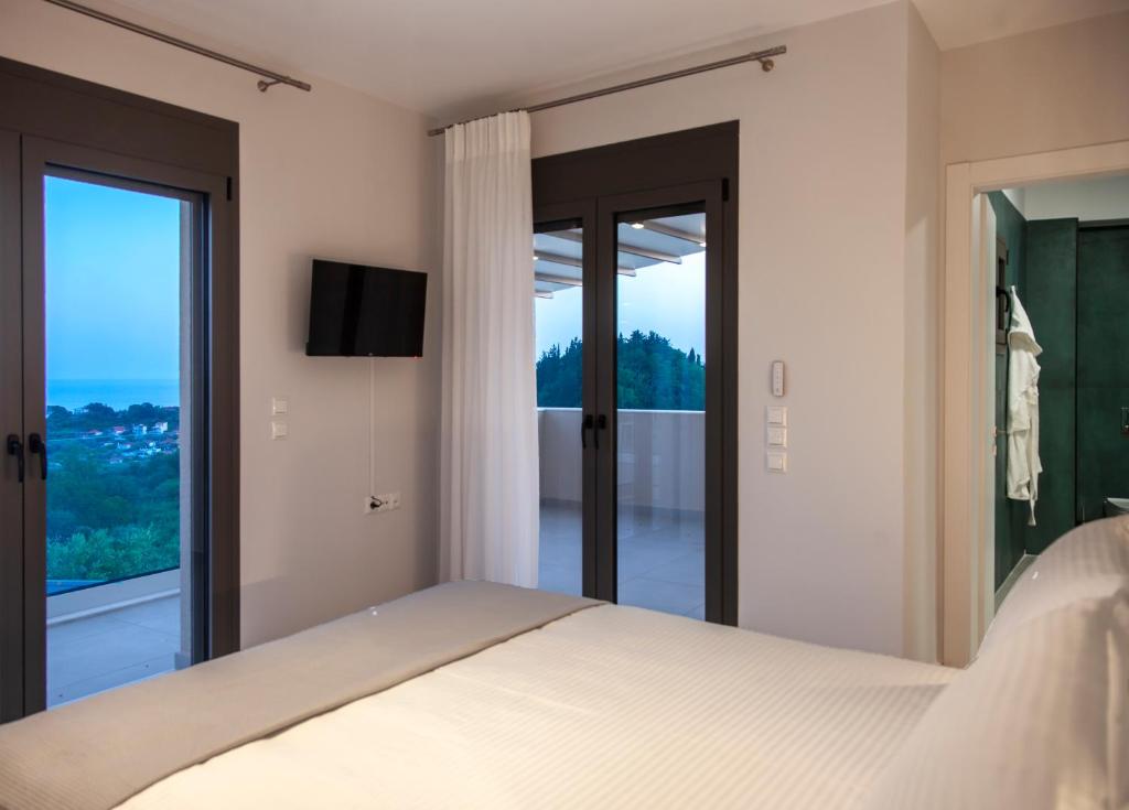 Posteľ alebo postele v izbe v ubytovaní LUMIERE VILLAS