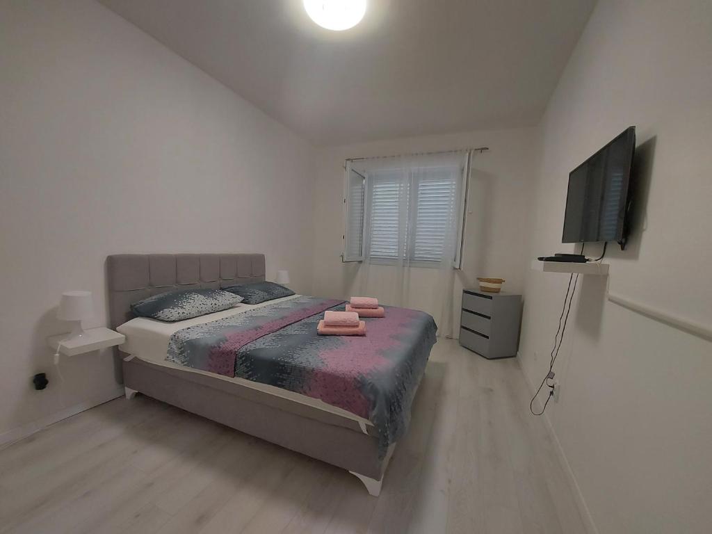 Postel nebo postele na pokoji v ubytování Apartment Nora Lastovo