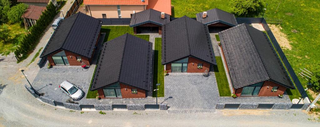 an overhead view of a house with a car at Brick House in Borşa