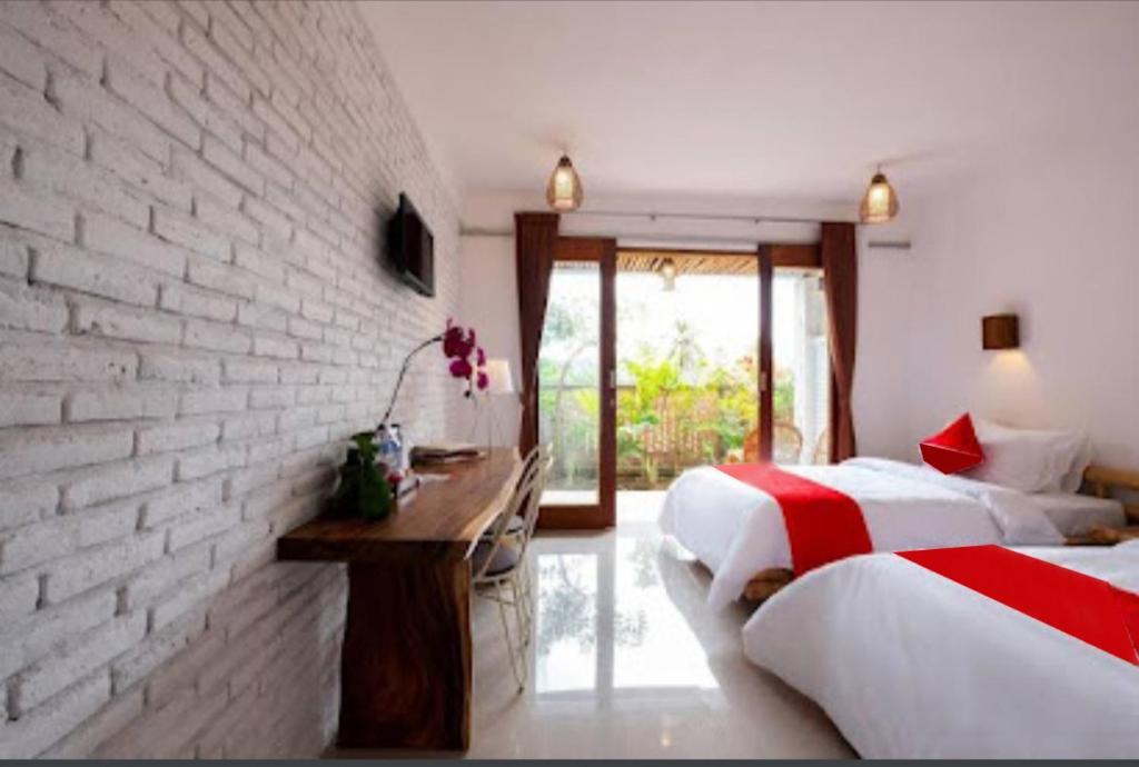 Postel nebo postele na pokoji v ubytování Surya Lombok Accommodation