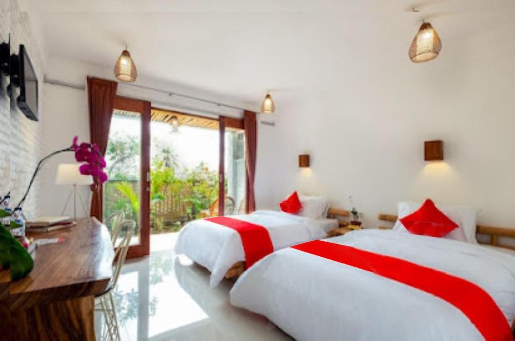 Postel nebo postele na pokoji v ubytování Surya Lombok Accommodation