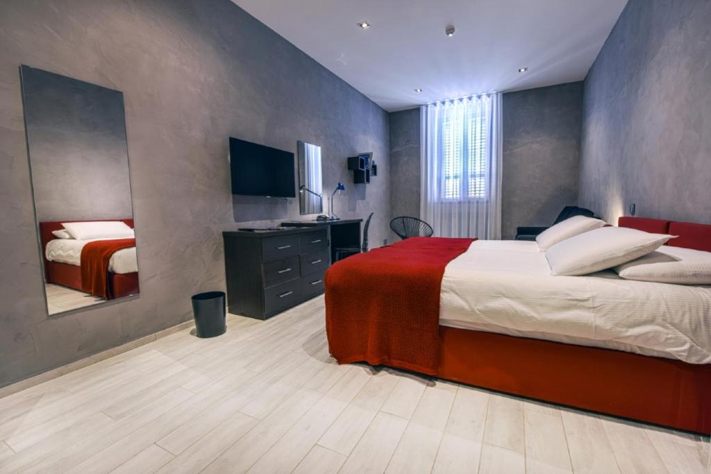 Postel nebo postele na pokoji v ubytování Quaint Boutique Hotel Xewkija