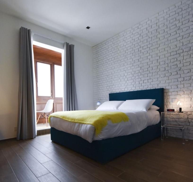 Postel nebo postele na pokoji v ubytování Quaint Boutique Hotel Xewkija