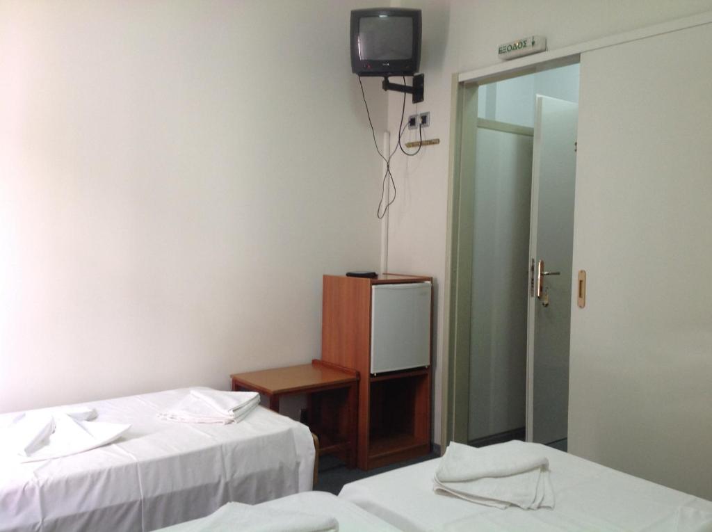 Postel nebo postele na pokoji v ubytování Morfeas Hotel
