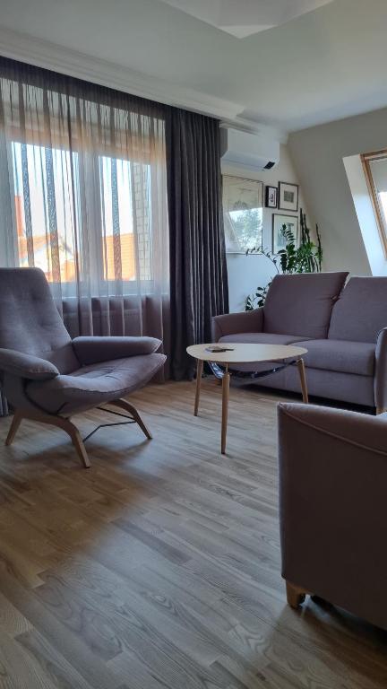 Posezení v ubytování Apartamentai Dana