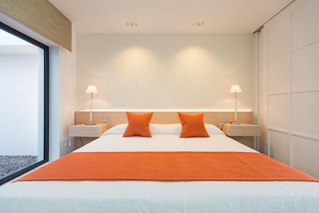 Postel nebo postele na pokoji v ubytování Altos de la Gloria Beach Apartments