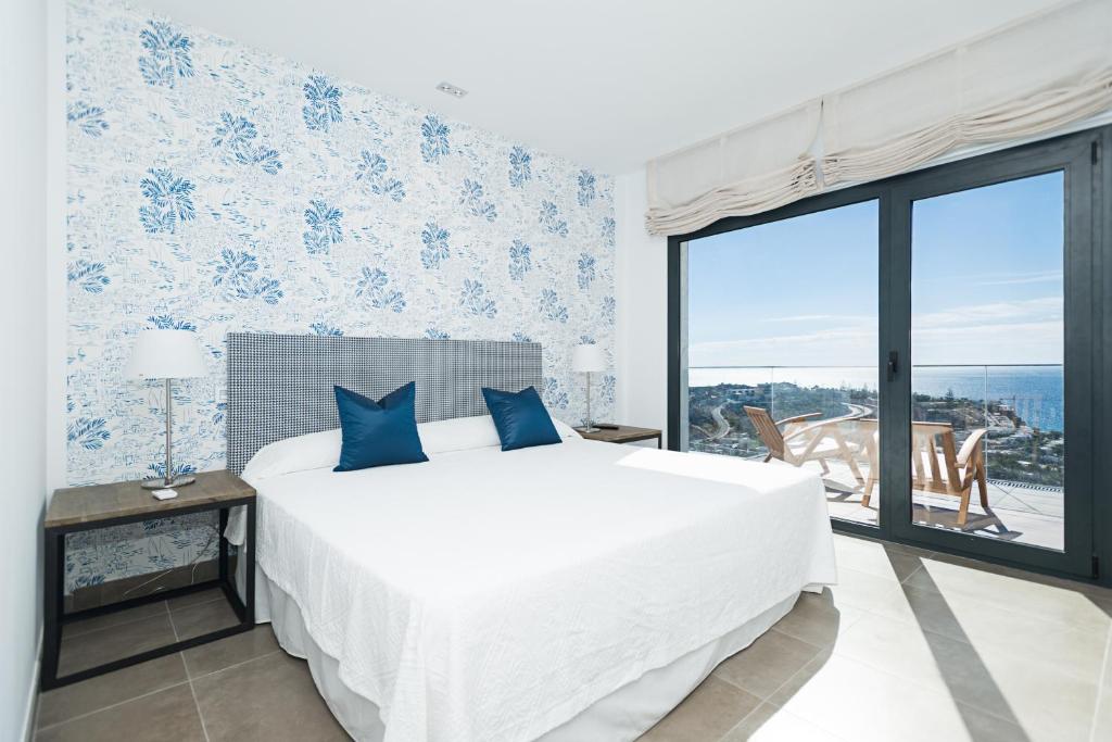 Postel nebo postele na pokoji v ubytování Altos de la Gloria Beach Apartments