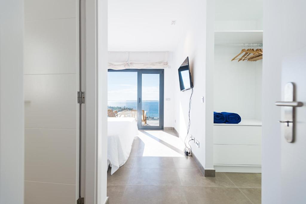 Postel nebo postele na pokoji v ubytování Altos de la Gloria Beach Apartments