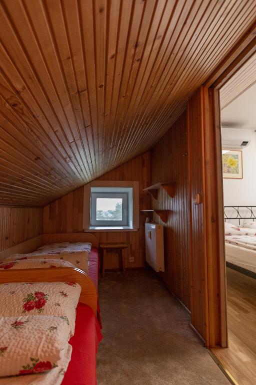 Postel nebo postele na pokoji v ubytování Apartamentai Dana
