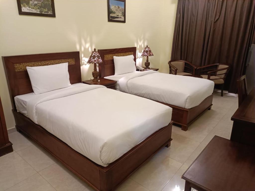 Postel nebo postele na pokoji v ubytování ROYAL HOTEL
