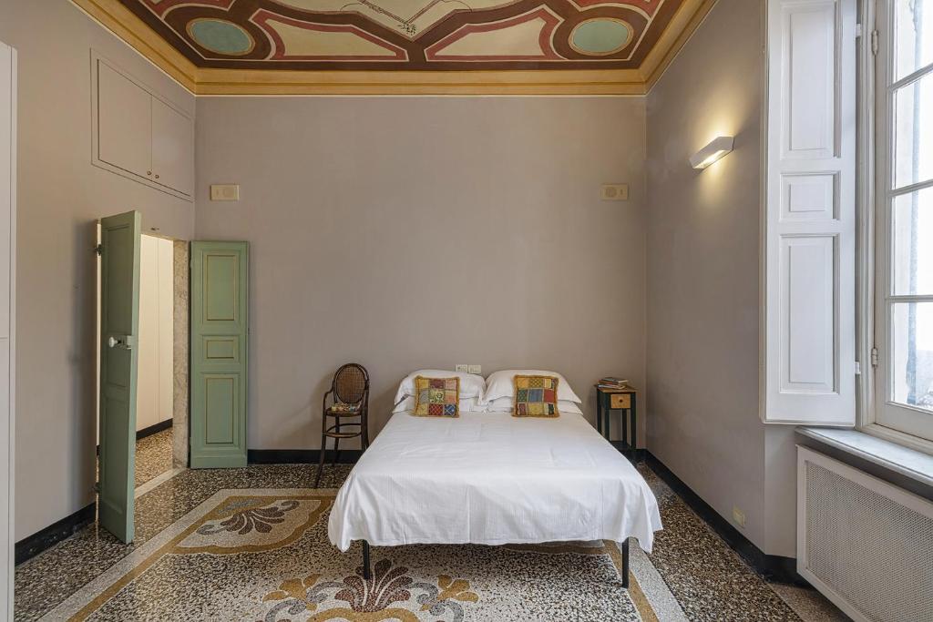 A bed or beds in a room at Fancy Apartment in Palazzo Grimaldi by Wonderful Italy