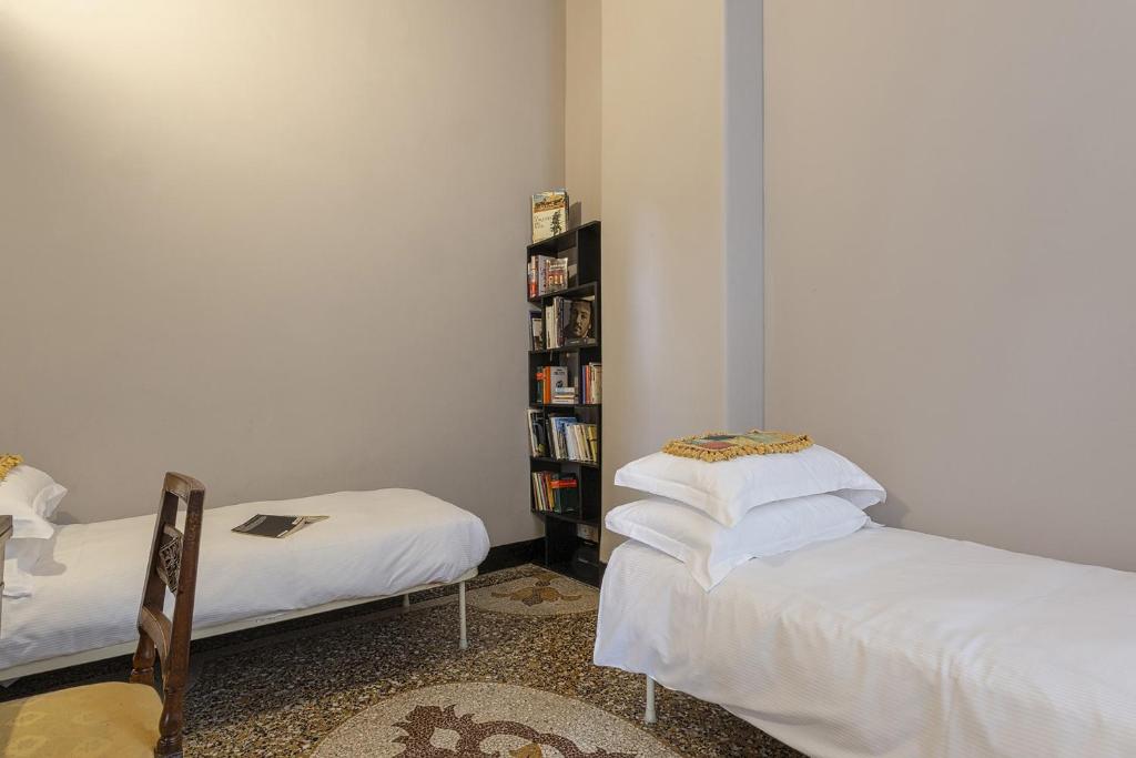 A bed or beds in a room at Fancy Apartment in Palazzo Grimaldi by Wonderful Italy