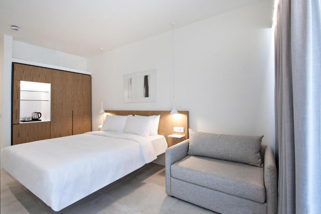 Tempat tidur dalam kamar di Radisson Resort Plaza Skiathos